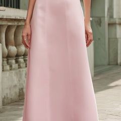 Elegant pink off-the-shoulder maxi dress by Christine Brewer, perfect for guests at weddings, displayed on a hanger.