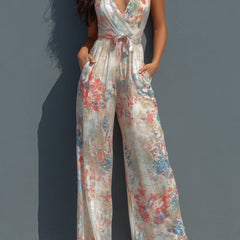 White floral satin halter neck jumpsuit with wrap front and wide-leg pants for women, by Christine Brewer.