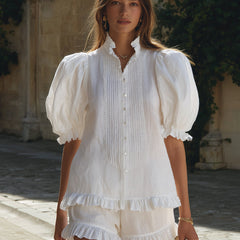 White linen puff sleeve two-piece co-ord set with pants for women by Christine Brewer, shown on a model.