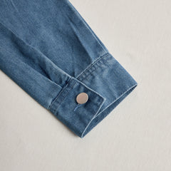 Women’s casual loose retro denim jumpsuit with hood, zipper front, long sleeves, and front pockets, by Christine Brewer.