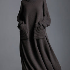 Brown knit maxi dress for women by Christine Brewer, featuring a flowing, cozy design and long sleeves.