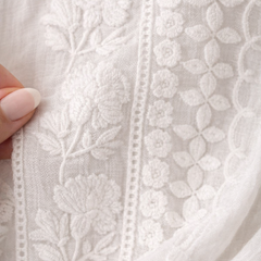 Floral white blouse for women from Christine Brewer's Isla collection, featuring lightweight fabric and delicate floral patterns.