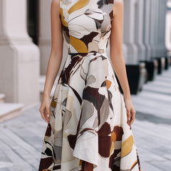 Abstract floral sleeveless fit and flare midi dress by Christine Brewer, featuring a vibrant floral pattern and a flattering silhouette.