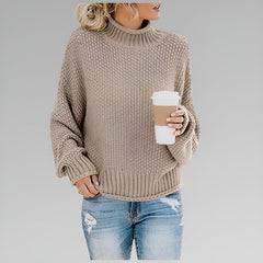 Amy Winifred ribbed orange sweater for women by Christine Brewer, featuring a close-up of the textured knit fabric and neckline.