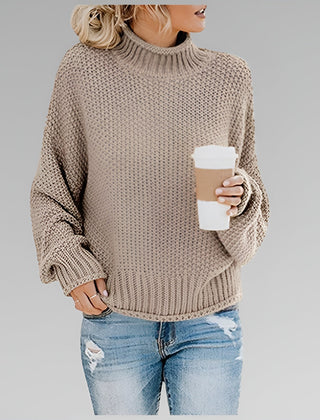 Amy Winifred ribbed orange sweater for women by Christine Brewer, featuring a close-up of the textured knit fabric and neckline.