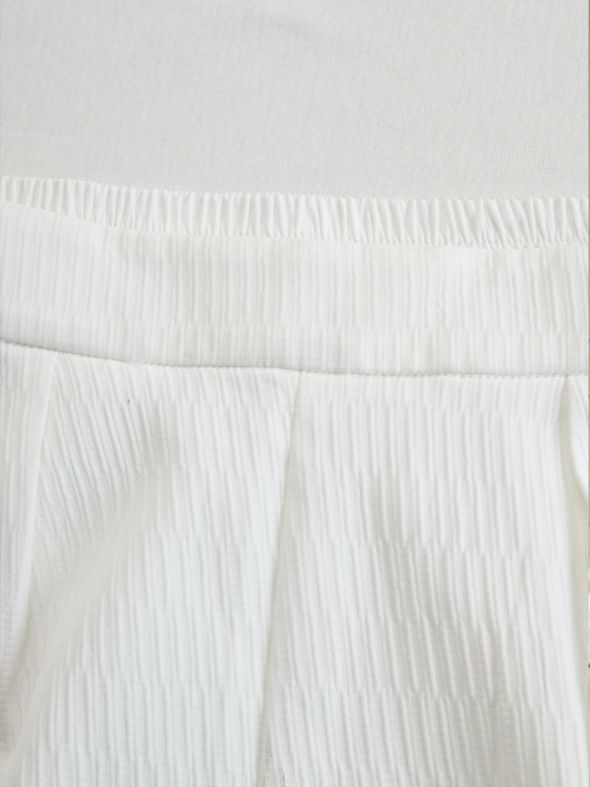 Cream textured lantern sleeve two-piece set with pants for women by Christine Brewer, shown on a model.