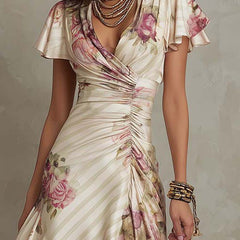 Christine Brewer chiffon floral midi dress, elegant evening dress with flowing fabric and vibrant floral pattern, shown on a hanger.