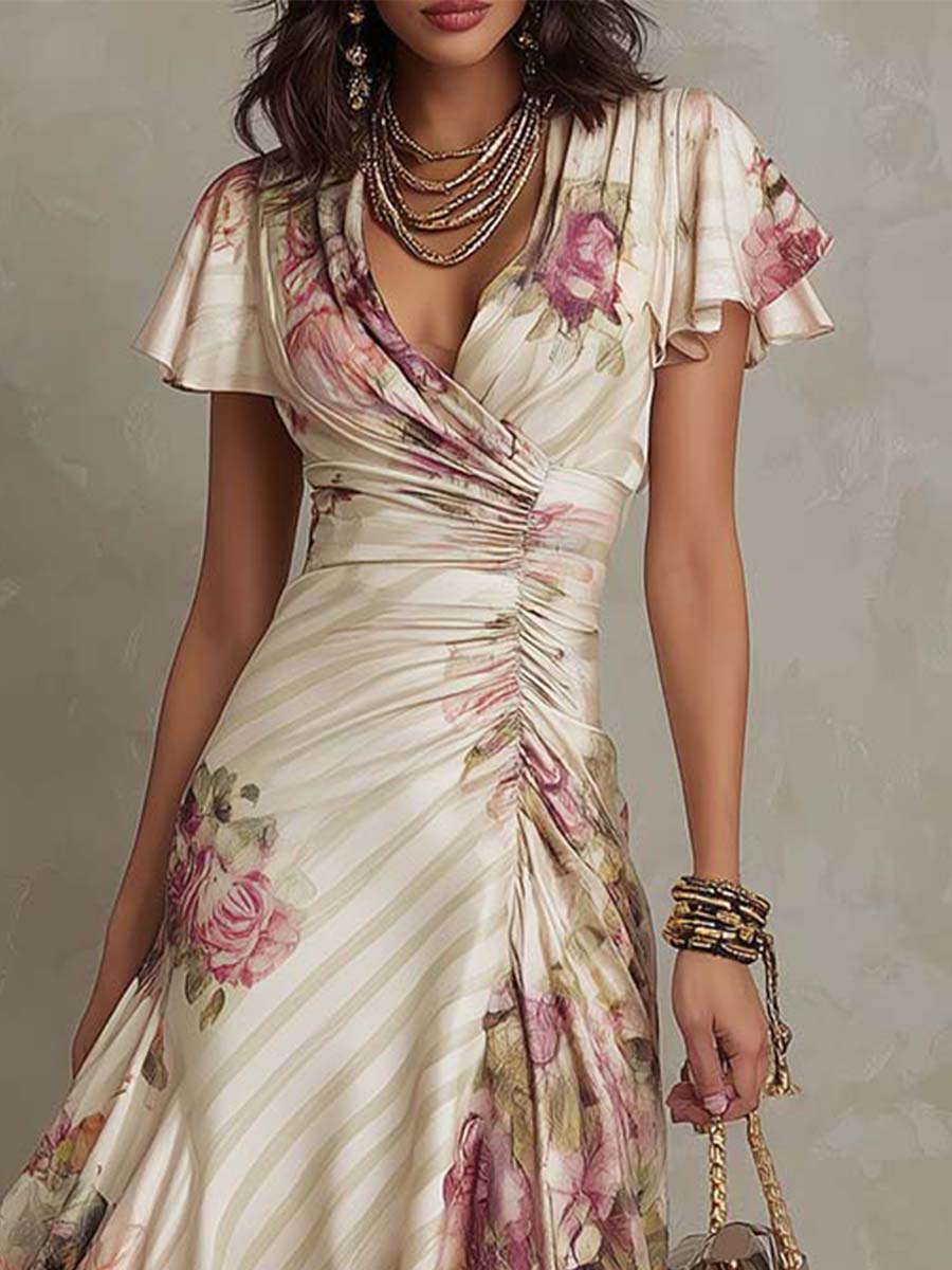Christine Brewer chiffon floral midi dress, elegant evening dress with flowing fabric and vibrant floral pattern, shown on a hanger.