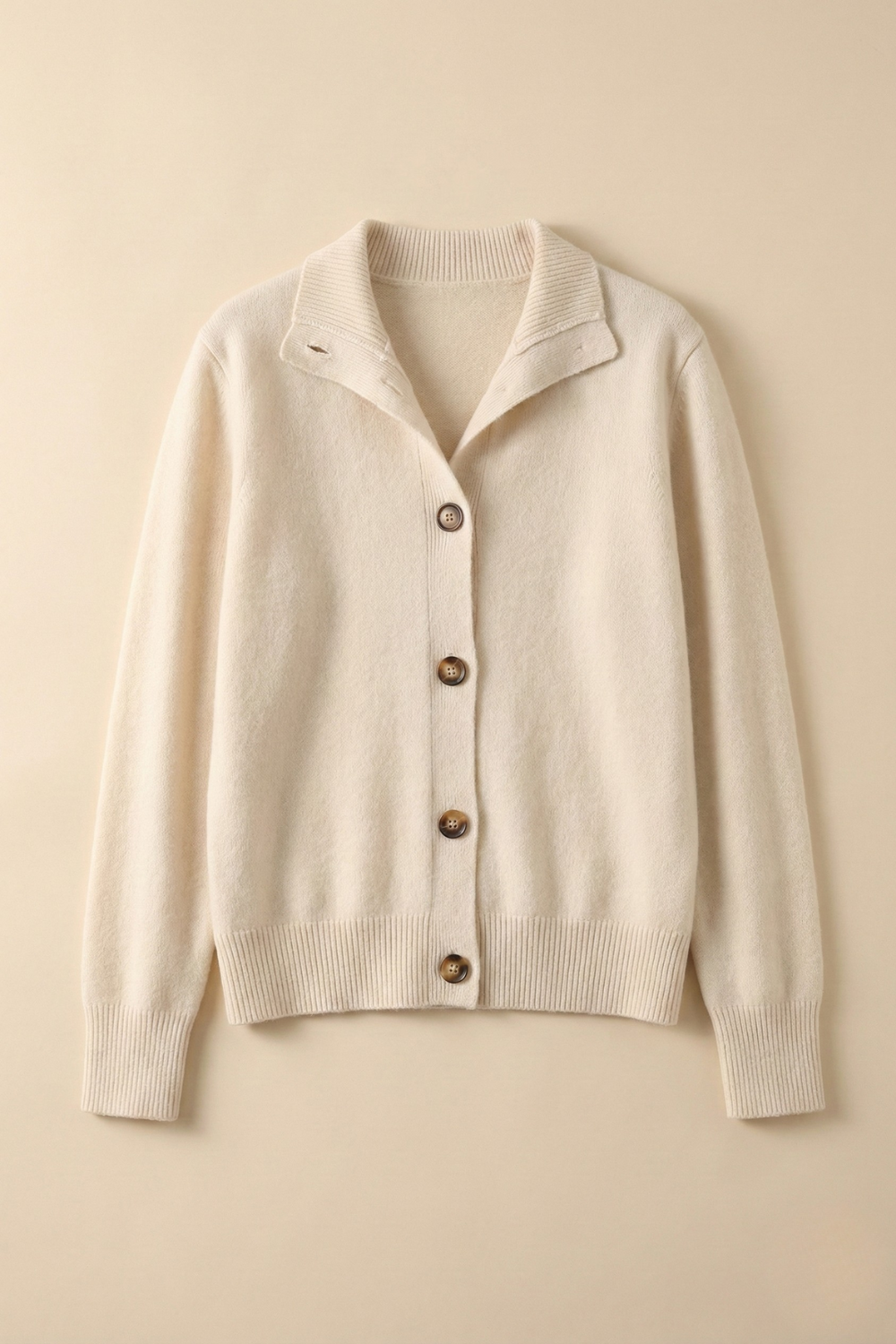 Christina Christine Brewer women's cashmere high neck cardigan, soft knit with long sleeves and button closure, in a cozy, elegant style.