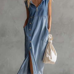 Blue denim V-neck midi dress by Christine Brewer, casual style with a fitted waist and knee-length hem, displayed on a model.