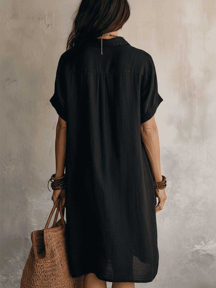 Black linen relaxed midi dress for women by Christine Brewer, featuring a flowy silhouette and casual style.