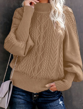 Women's knit sweater by Christine Brewer, featuring a cozy Lauren design, styled with a soft, textured fabric in neutral tones.