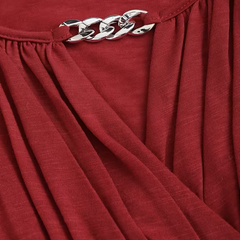 Olivia V-neck top for women by Christine Brewer, featuring a fitted design and soft fabric, shown in a stylish casual setting.