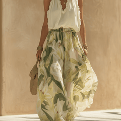 White flowing maxi dress for women by Christine Brewer, lightweight fabric, elegant design, and full-length style.