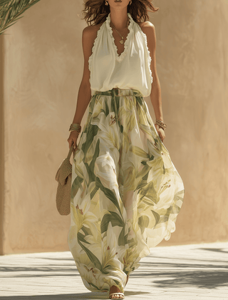 White flowing maxi dress for women by Christine Brewer, lightweight fabric, elegant design, and full-length style.