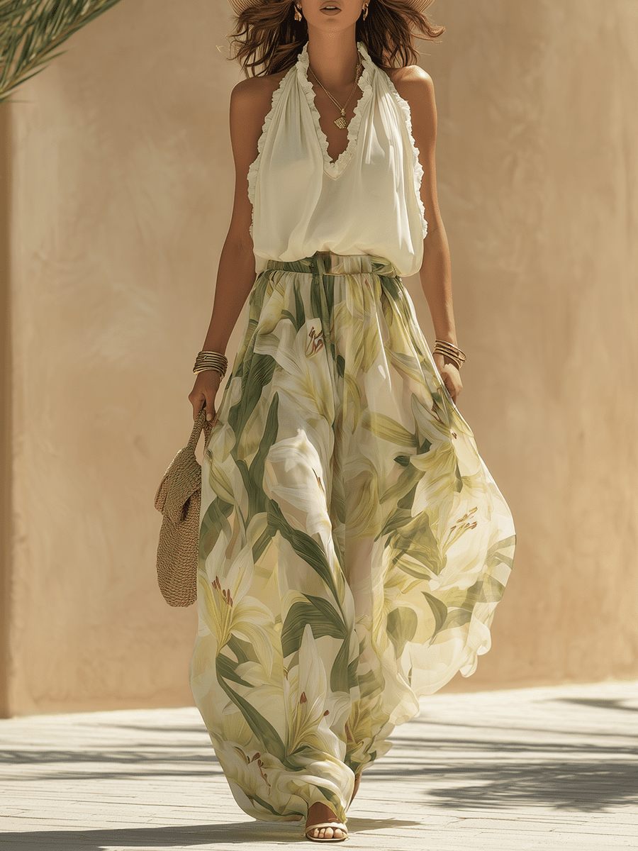 White flowing maxi dress for women by Christine Brewer, lightweight fabric, elegant design, and full-length style.