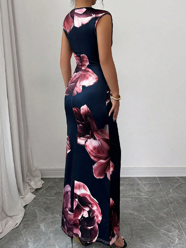 White bodycon sleeveless maxi dress by Christine Brewer with contrast color flower print and round neckline, perfect for summer.