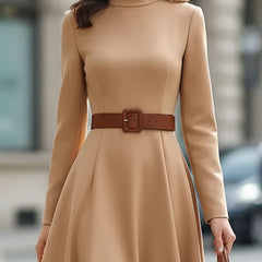 Elegant camel turtleneck belted midi dress by Christine Brewer, shown with a flowing silhouette and stylish belt detail.