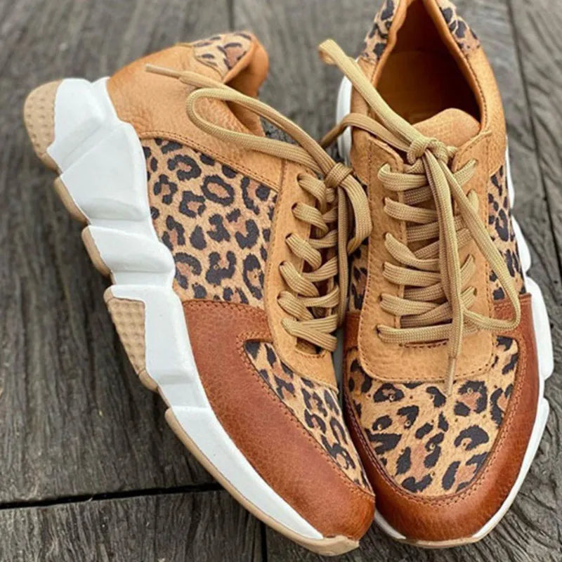 Comfortable leopard print orthopedic sneakers for women with thick soles and lace-up design, ideal for walking and casual wear.