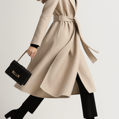 Olivia long belted wool coat for women by Christine Brewer, featuring a tailored fit and elegant design in neutral wool fabric.