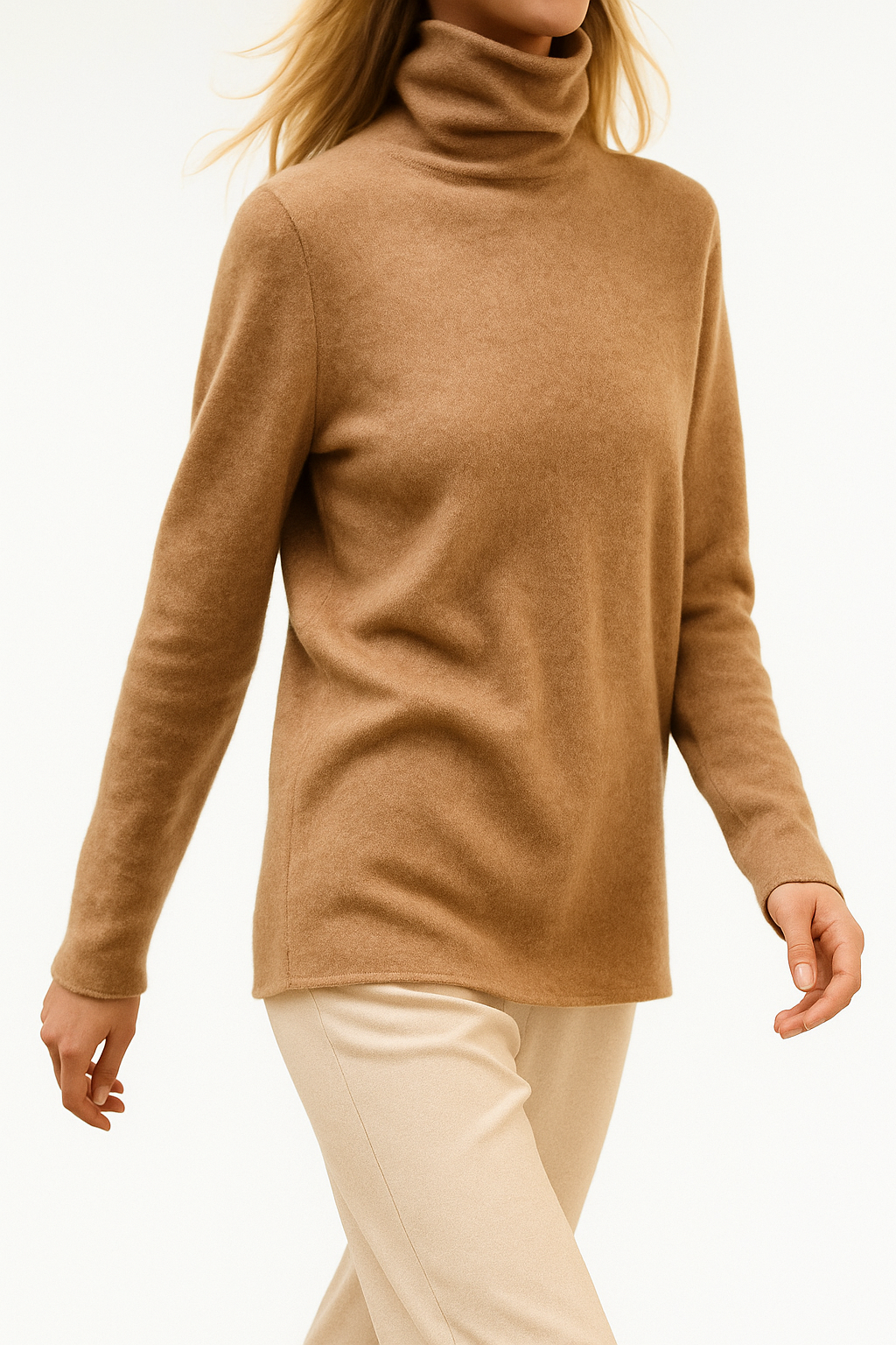 Elegant women's cashmere turtleneck sweater by Christine Brewer, featuring a cozy, stylish design in a soft, neutral color.