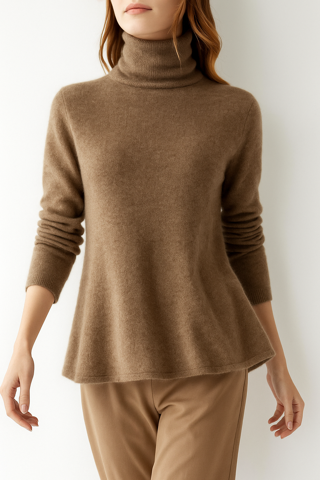 Elegant cashmere turtleneck sweater for women by Christine Brewer, shown in a stylish fit with soft, luxurious fabric.