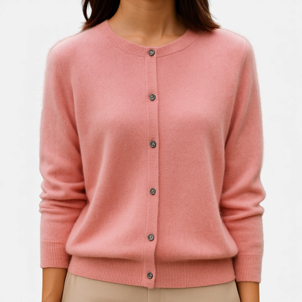 Pink cashmere sweater by Christine Brewer, featuring a versatile classic design, soft knit texture, and elegant fit.