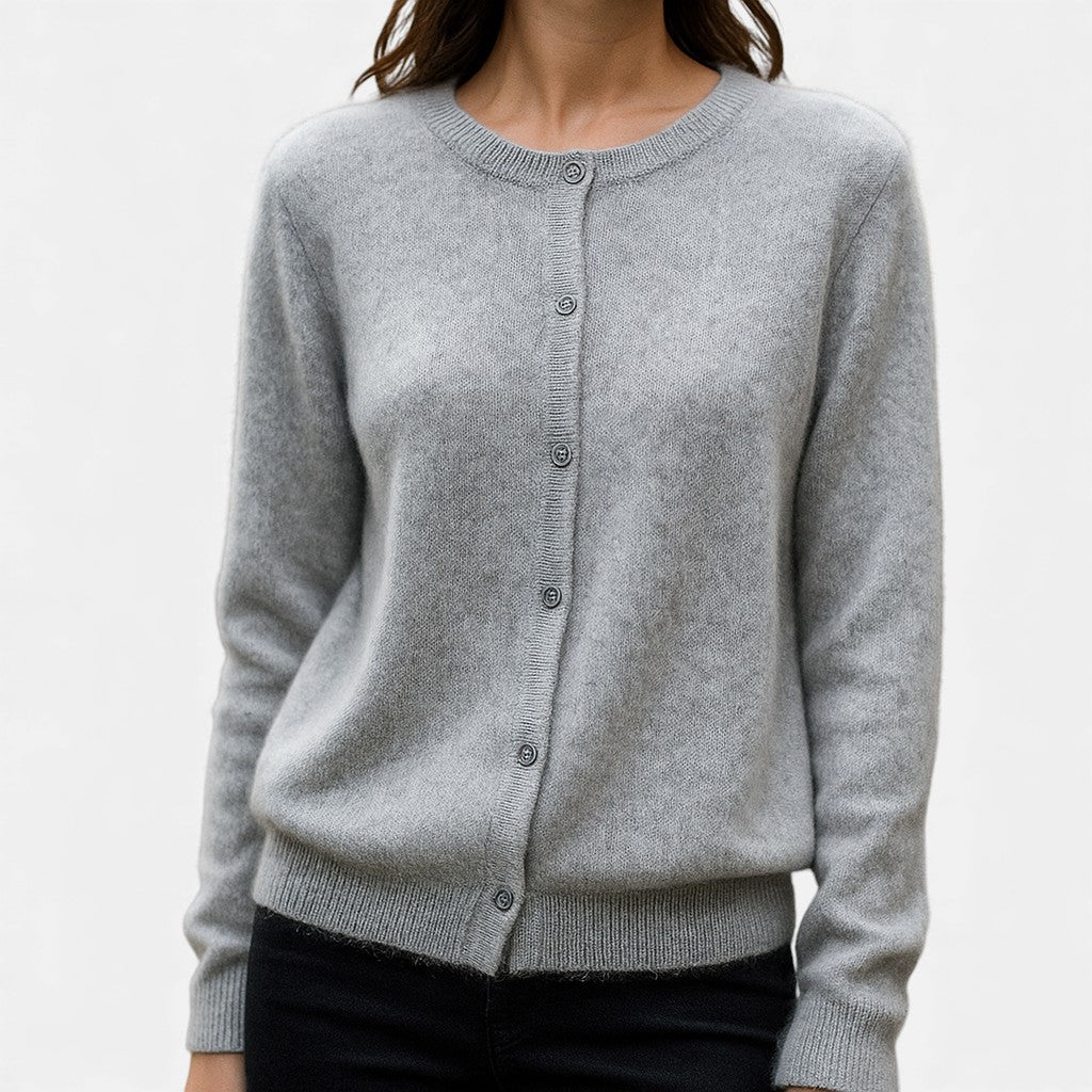 Christine Brewer Stella cashmere button-front sweater for women, shown in a stylish display with a close-up of the soft knit fabric.