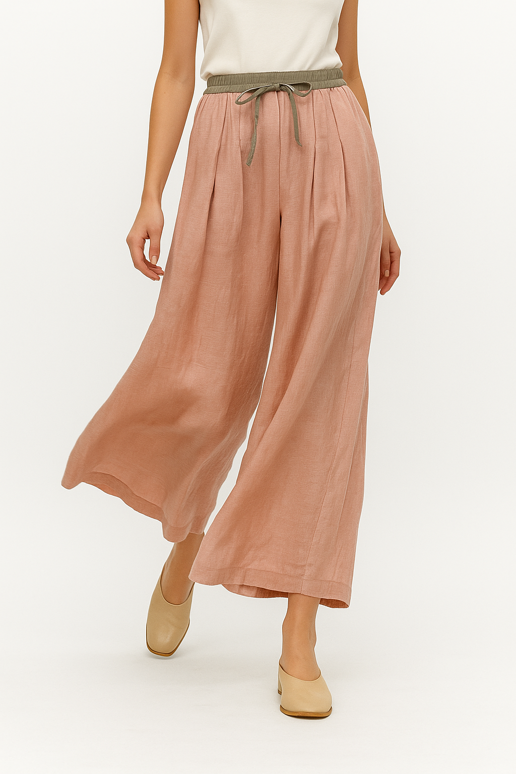 Elegant tapered linen trousers for women by Christine Brewer, featuring a loose pull-on design and relaxed fit.