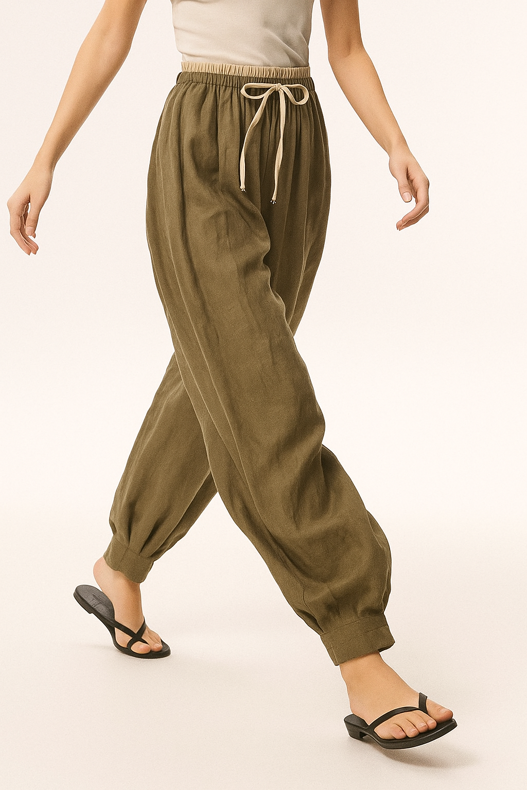 Women’s tapered linen trousers by Christine Brewer, loose pull-on pants with relaxed fit and lightweight, breathable fabric.