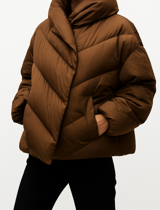 Brown cropped hooded puffer jacket for women by Christine Brewer, featuring a stylish padded design and hooded collar.