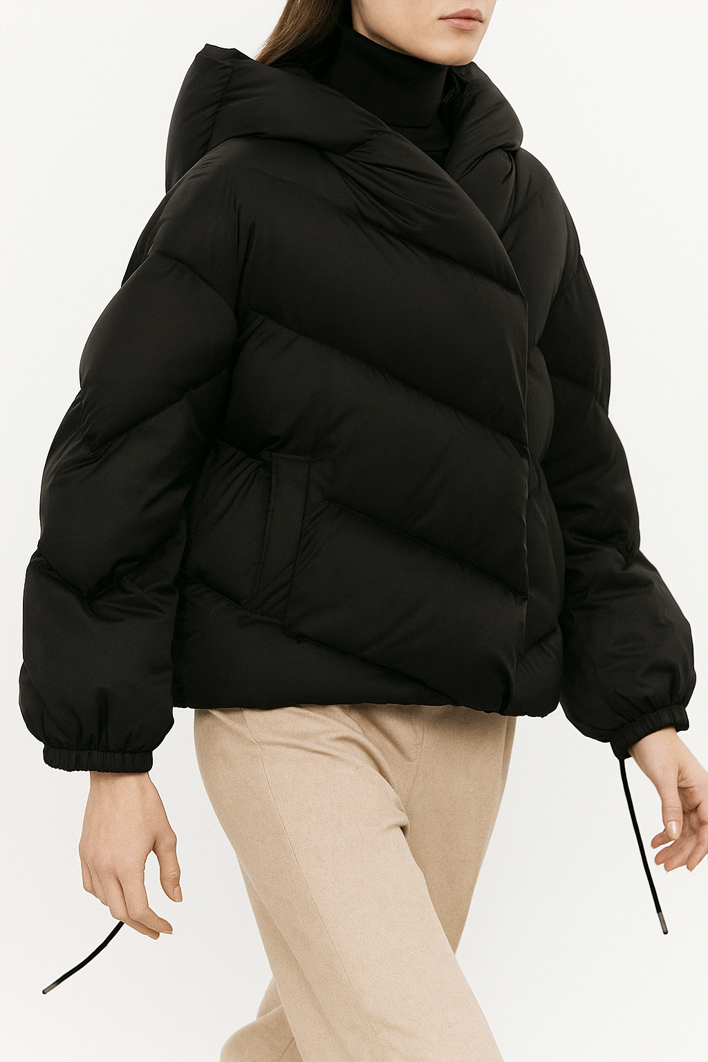 Women's cropped hooded puffer jacket by Christine Brewer, stylish high-end puffer with a hood and quilted design.