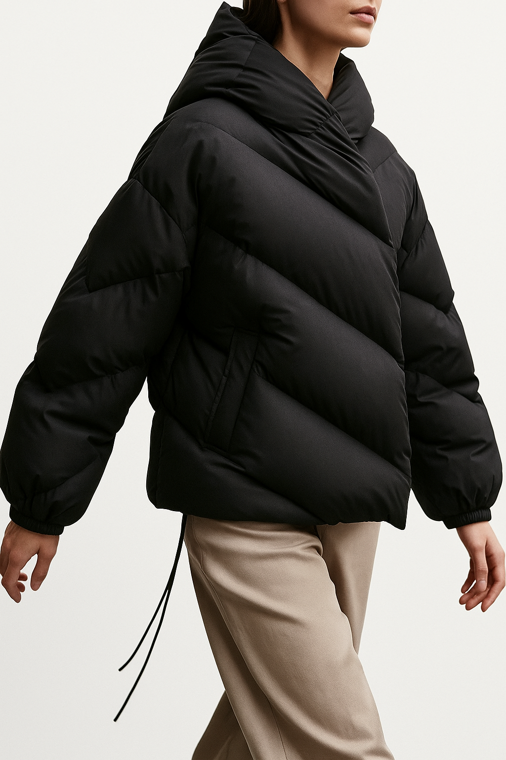 Women’s cropped hooded puffer jacket by Christine Brewer, stylish high-end puffer with a hood, perfect for cold weather.