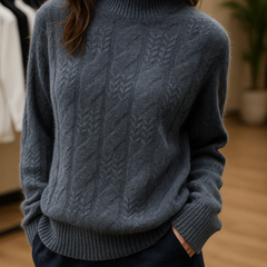 Elegant beige cashmere cable knit sweater for women by Christine Brewer, displayed on a mannequin.