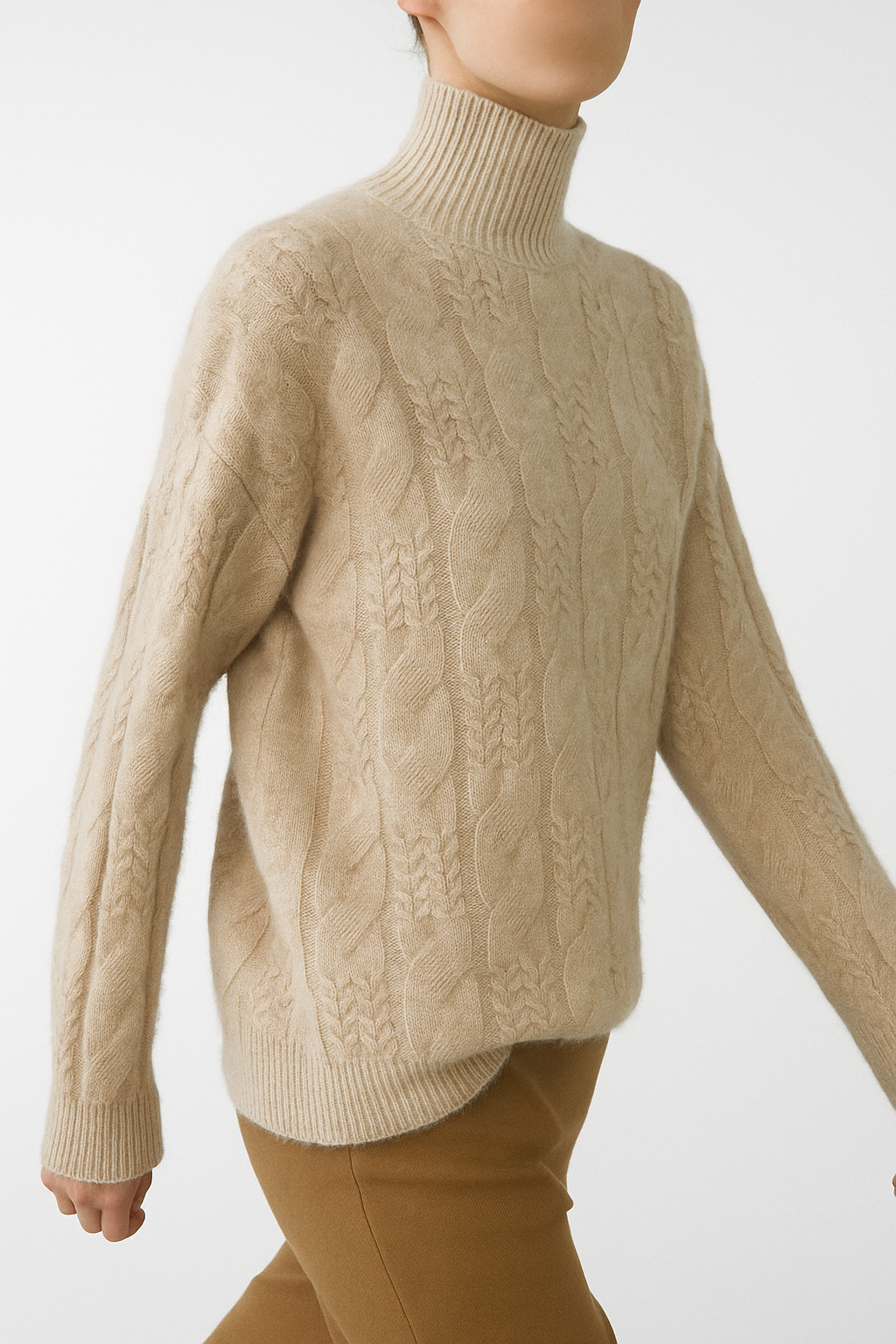 Cashmere cable knit sweater for women in beige, featuring a cozy, textured design and ribbed cuffs, by Christine Brewer.