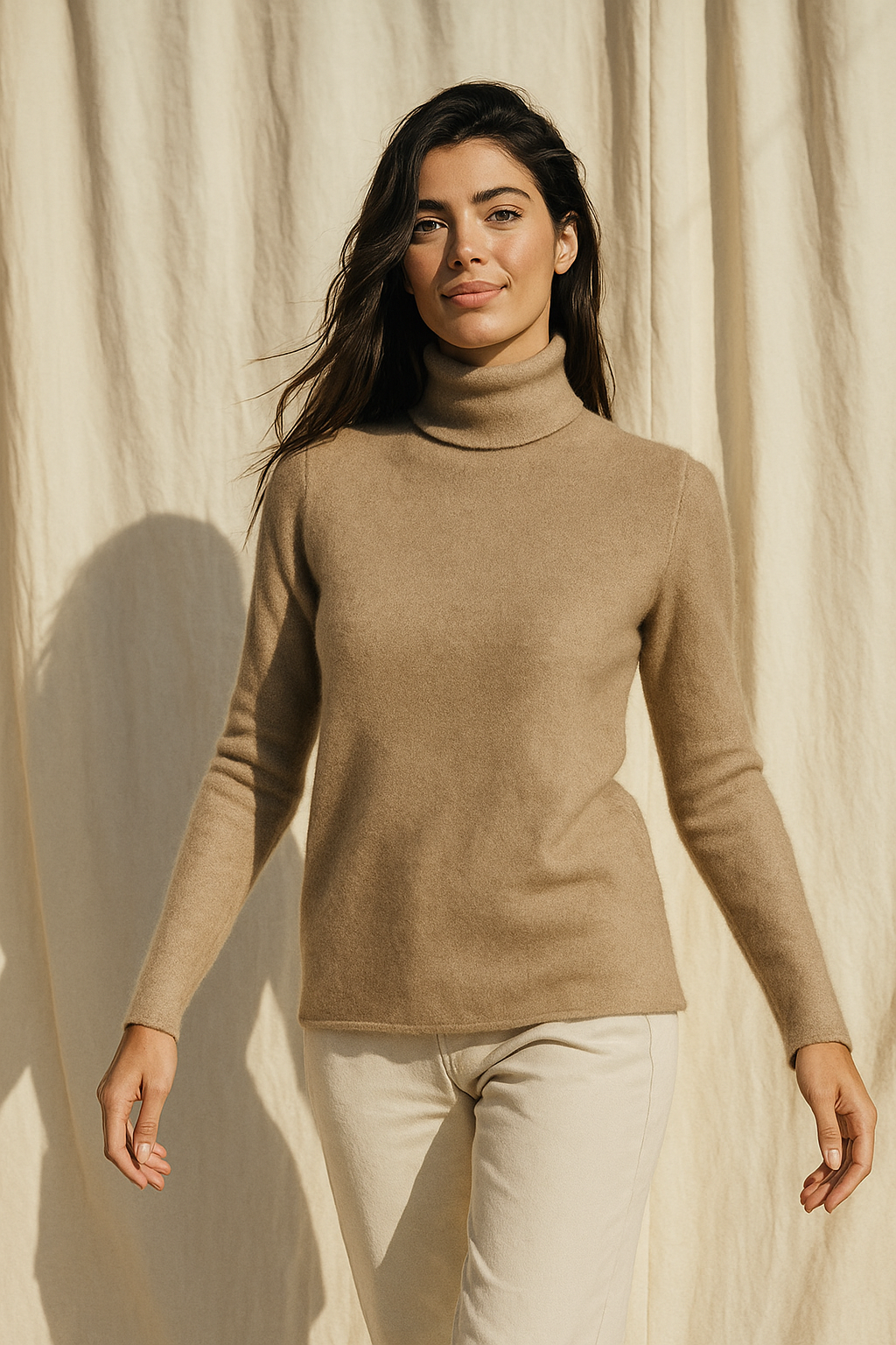 Beige cashmere turtleneck sweater for women by Christine Brewer, featuring a cozy, stylish design and soft knit texture.