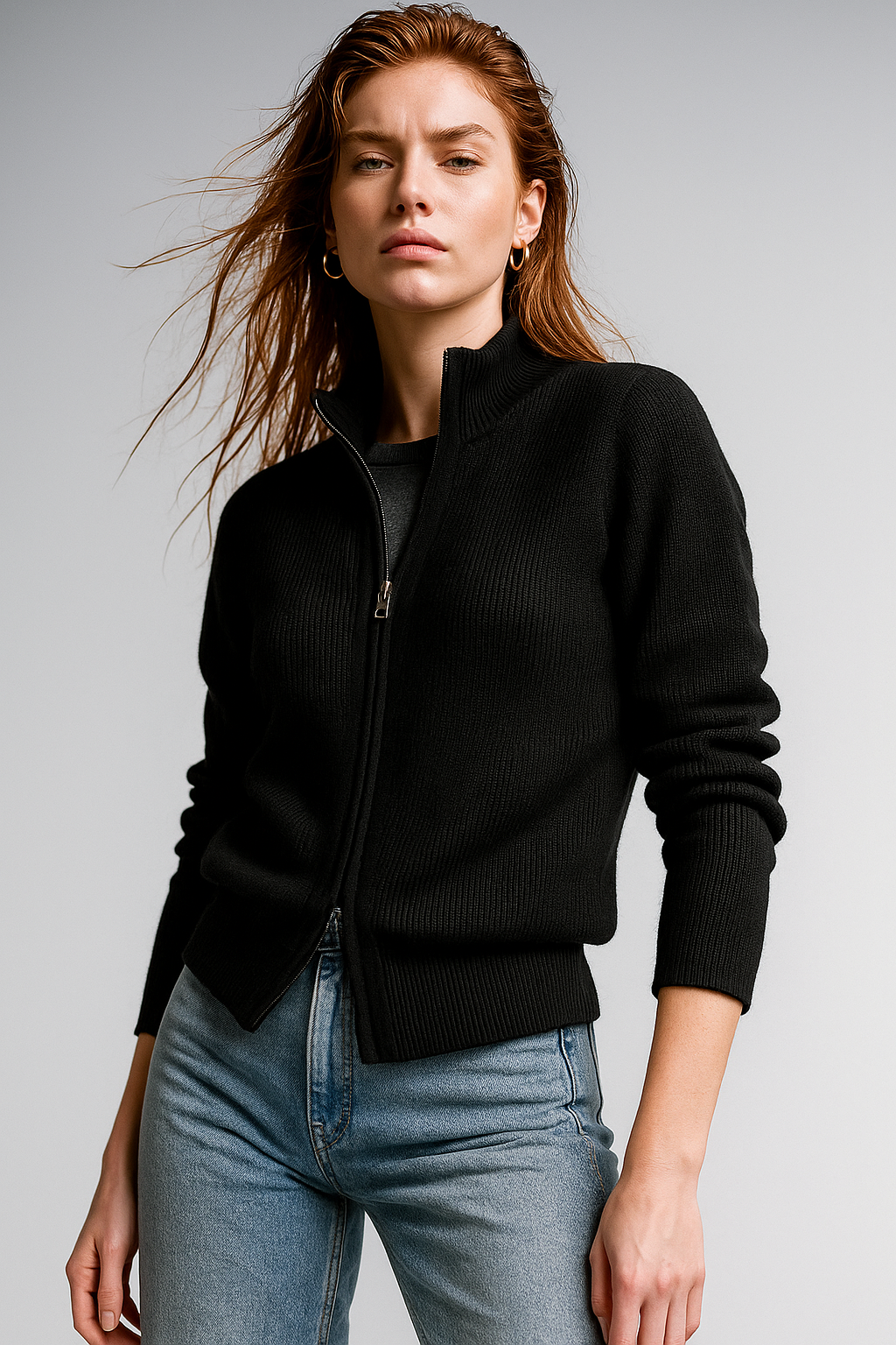 Women’s wool zip-up cardigan by Christine Brewer featuring a classic jean style and front zipper detail.