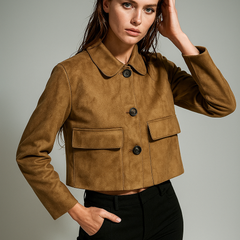 Elegant beige faux suede cropped jacket for women by Christine Brewer, showcased on a stylish display.