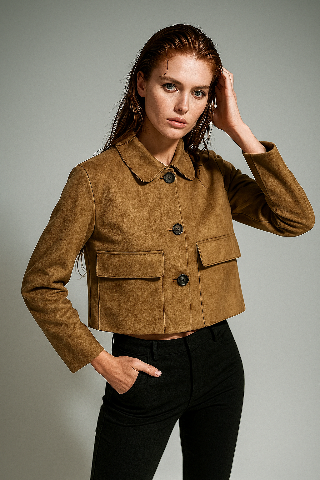Elegant beige faux suede cropped jacket for women by Christine Brewer, showcased on a stylish display.