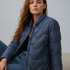 Blue Aurora quilted puffer jacket for women by Christine Brewer, short style with quilted stitching and a warm, padded design.