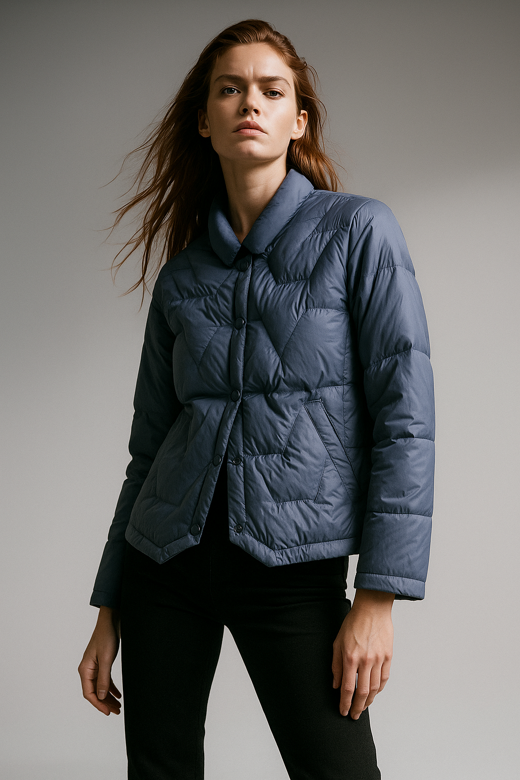 Blue Aurora short quilted puffer jacket for women by Christine Brewer, featuring a stylish quilted design and a fitted silhouette.