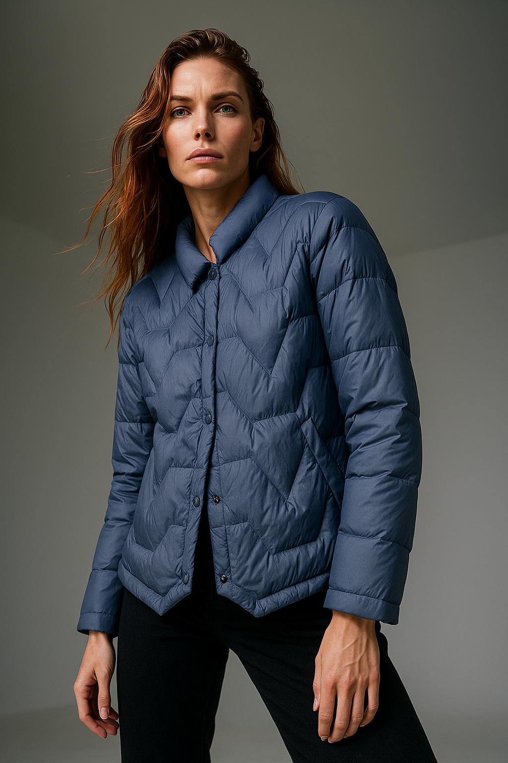 Blue Aurora short quilted puffer jacket for women by Christine Brewer, featuring a stylish, padded design and a cozy fit.