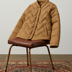 Aurora short quilted puffer jacket for women by Christine Brewer, shown in a stylish shot highlighting its quilted design and cozy fit.