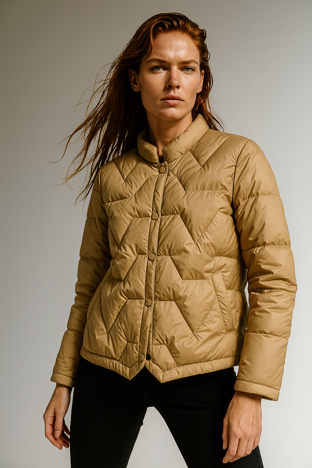 Beige Aurora short quilted puffer jacket for women by Christine Brewer, featuring a stylish, padded winter coat with a high collar.