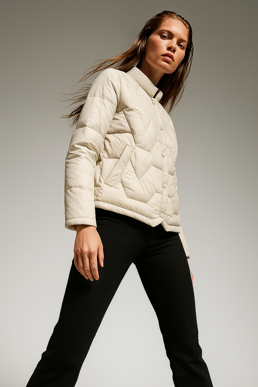Ivory short quilted puffer jacket for women by Christine Brewer, featuring a stylish, padded design for warmth and comfort.