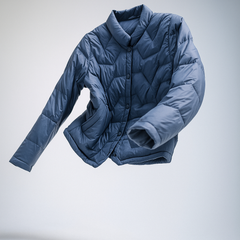 Floating blue Christine Brewer Aurora short quilted puffer jacket for women, lightweight and stylish outerwear.