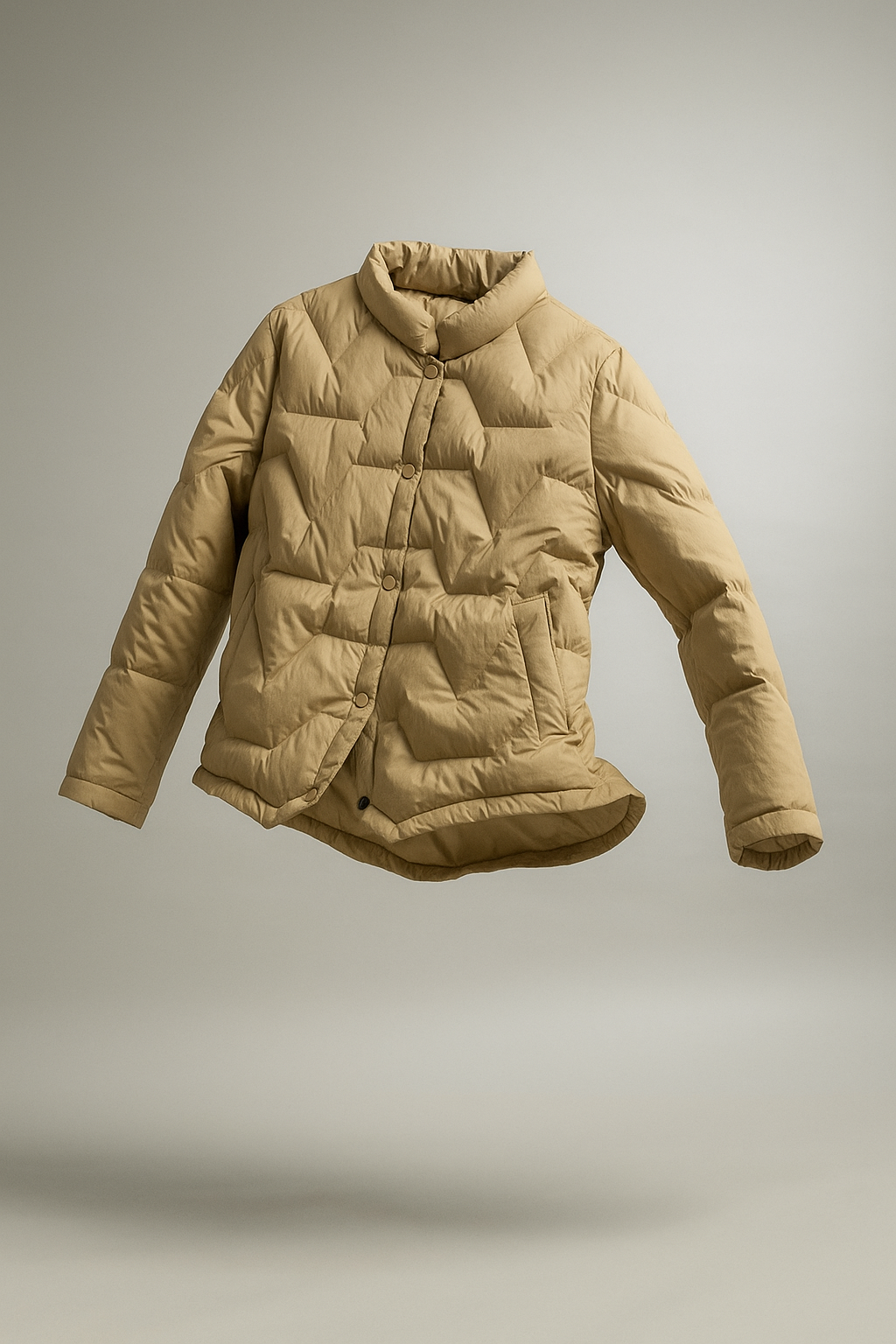 Women’s Aurora short quilted puffer jacket by Christine Brewer displayed on a mannequin, featuring a lightweight, insulated design.
