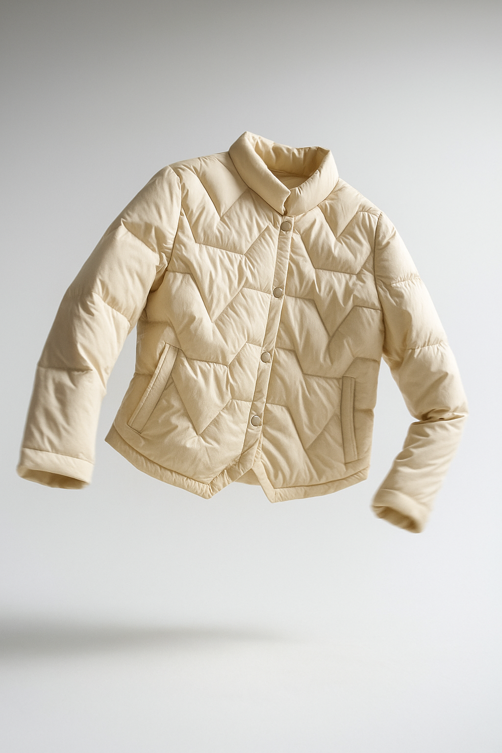Christine Brewer Aurora short quilted puffer jacket for women, lightweight and stylish with a glossy finish and quilted design.