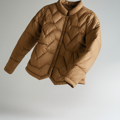 Women’s Aurora short quilted puffer jacket by Christine Brewer, featuring a stylish floating illusion design.