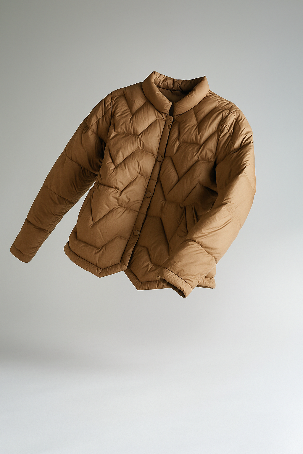 Women’s Aurora short quilted puffer jacket by Christine Brewer, featuring a stylish floating illusion design.